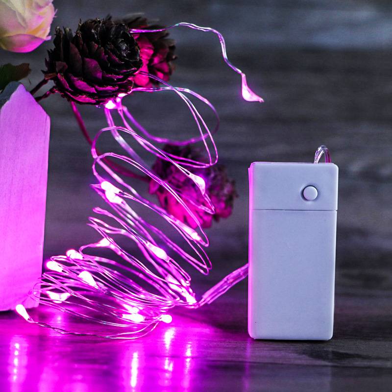 LED fairy lights woven into wedding floral arrangements